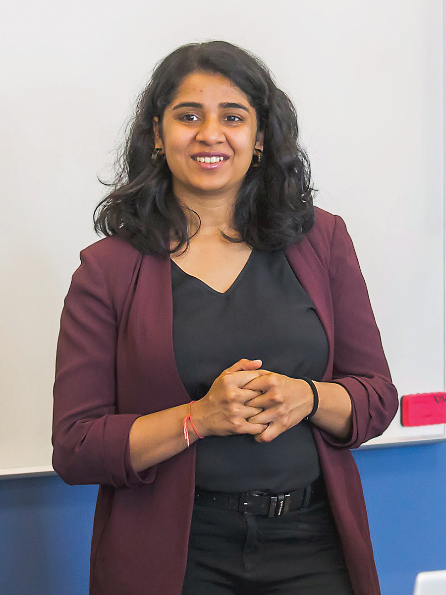 Person standing in front of a class.