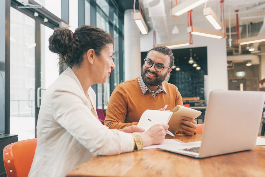 Graduate Student-at-Large Business: two people talking to each other