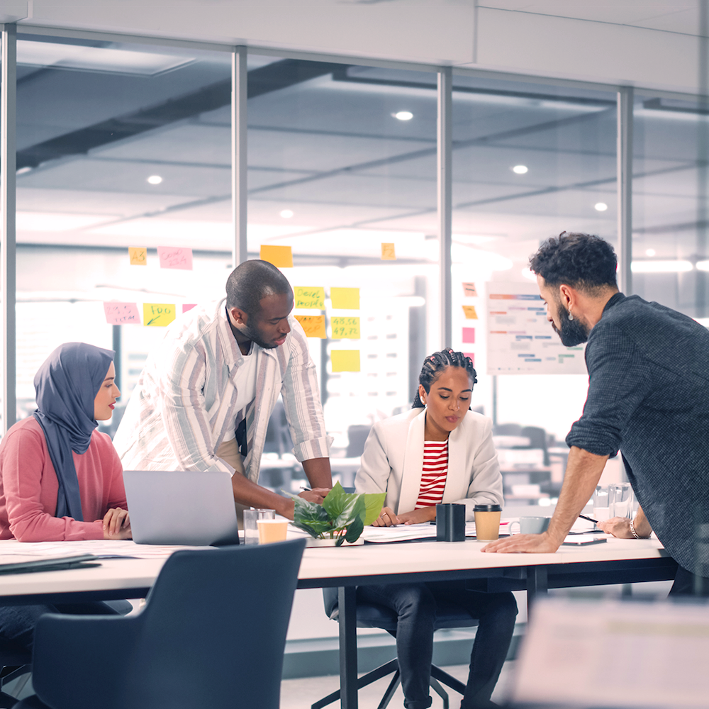 A group of professionals have a meeting in an office.