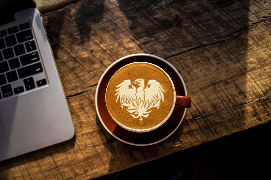 UChicago shield on a coffee mug.