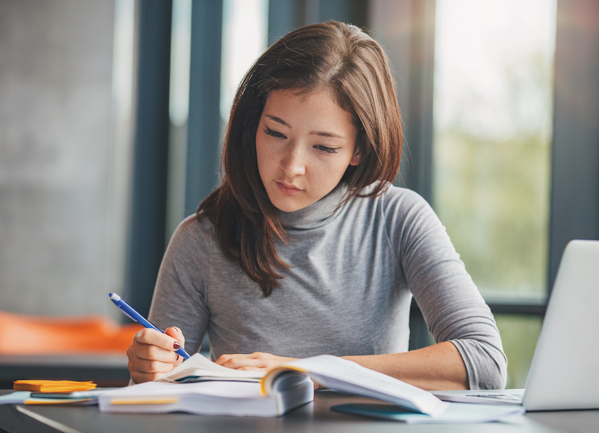 A student studying at a library