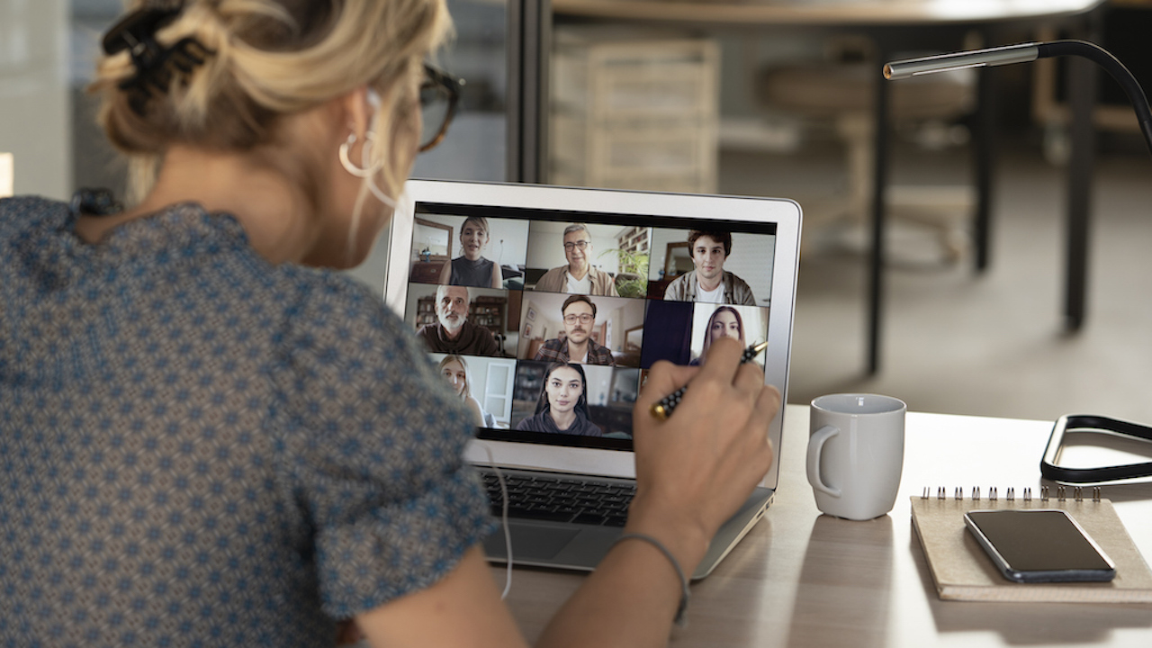 Talking and working on video calling with colleagues.