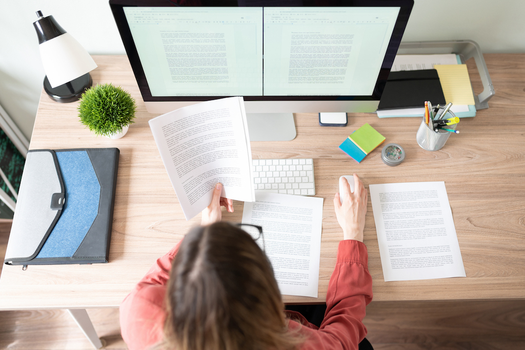 A woman working on a document.