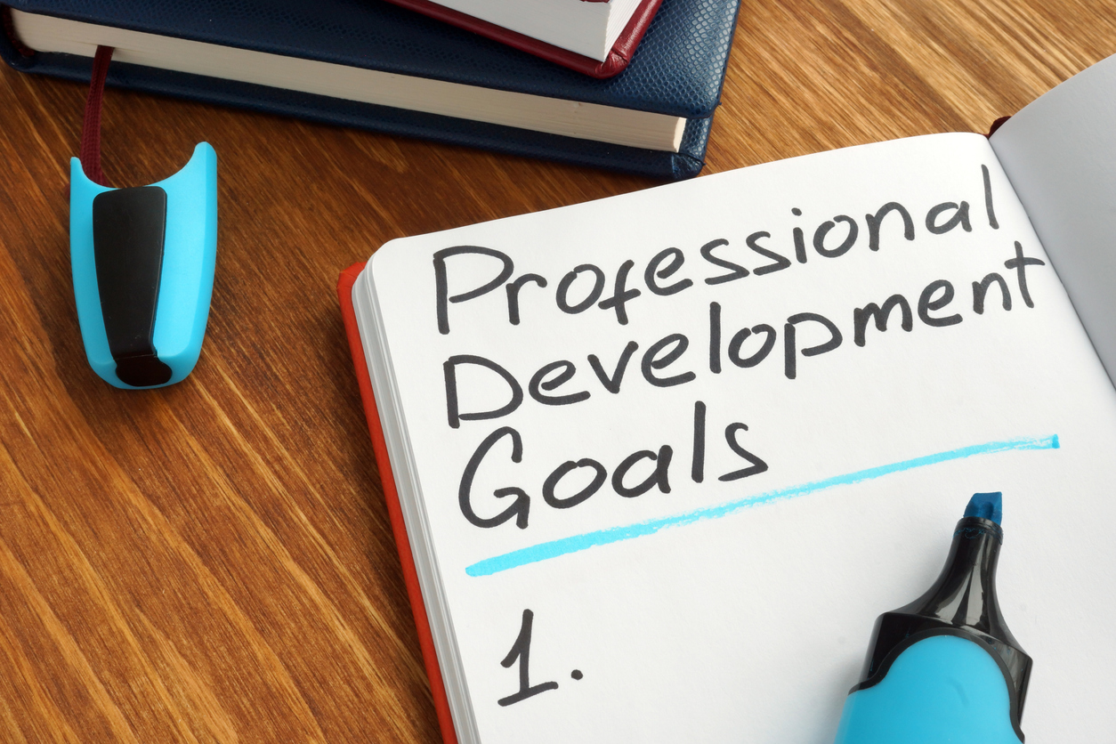 Professional development goals list in a notebook.
