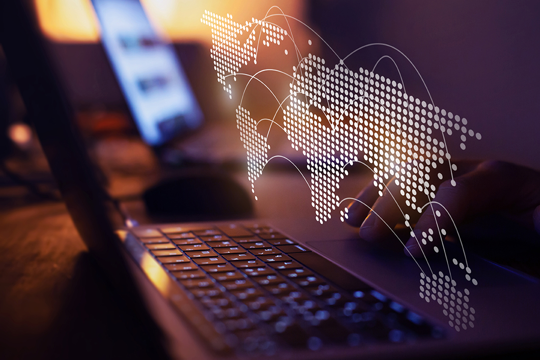 laptop with a global map on it