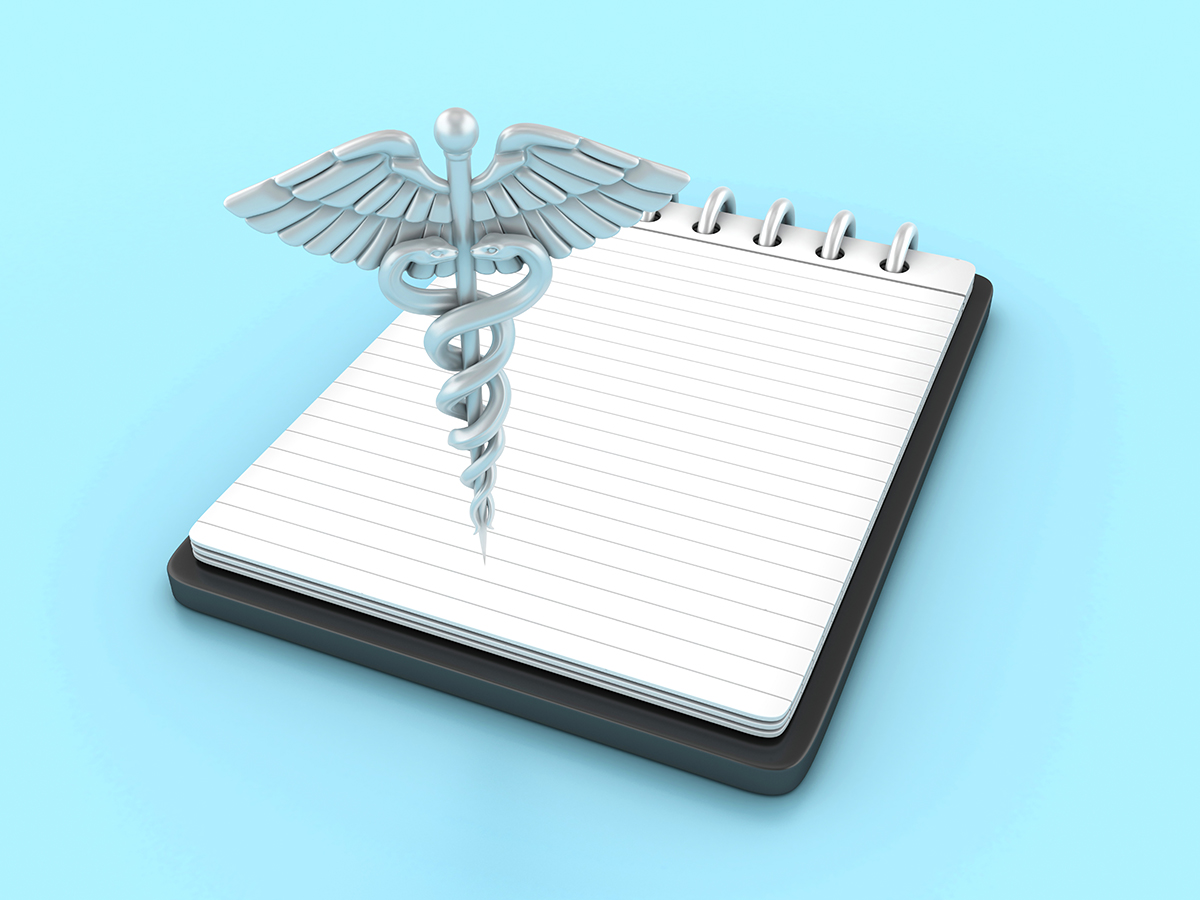 medicine icon over a notebook