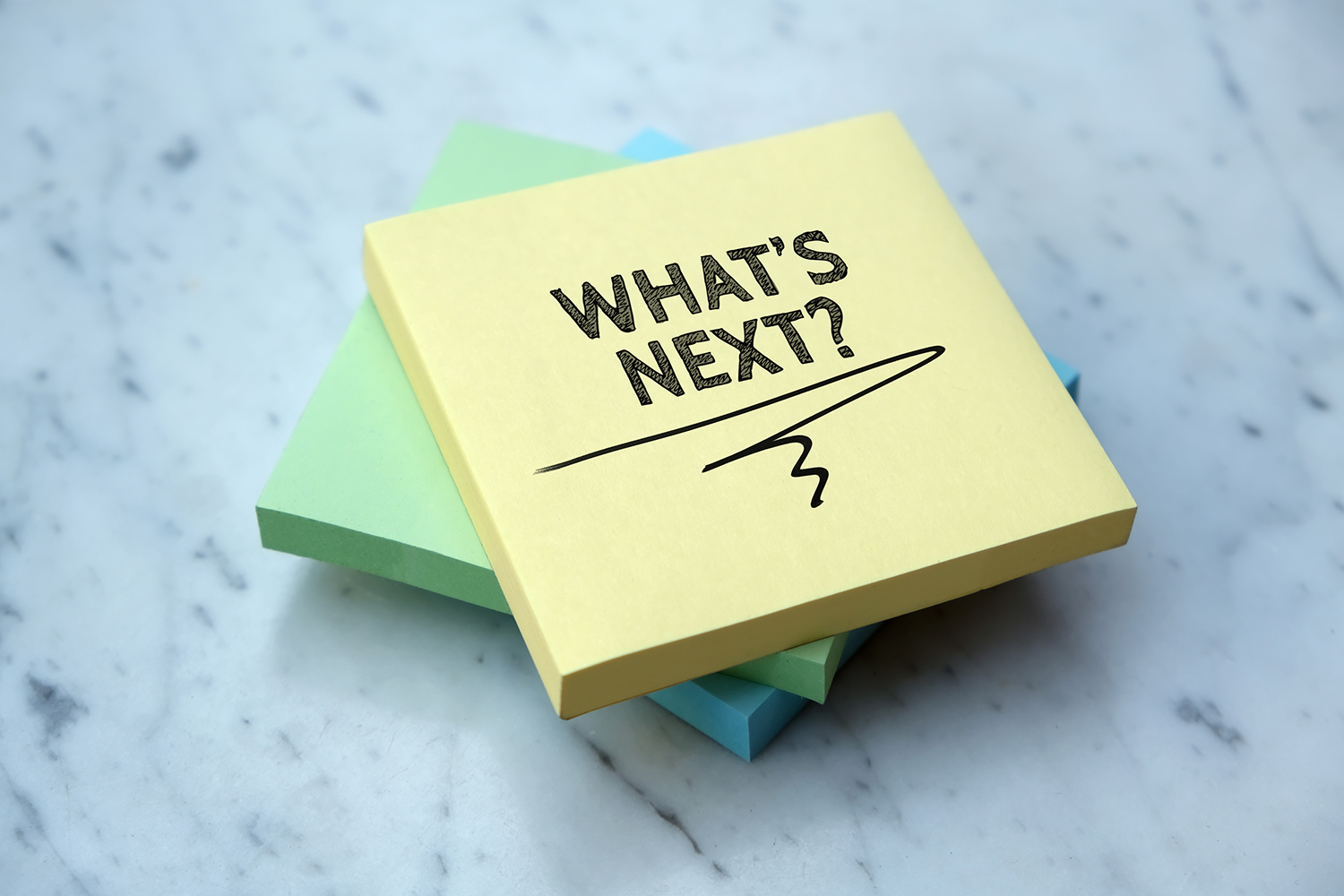 Post-it note with the words "what's next?"