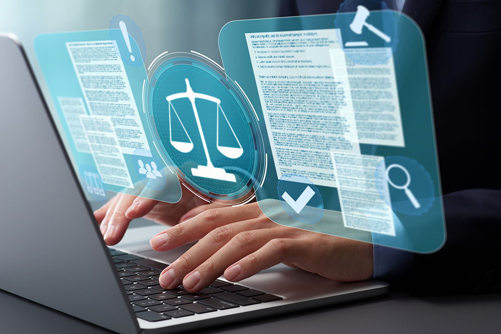 Hands typing on a laptop with illustrations of legal scales and documents floating over.