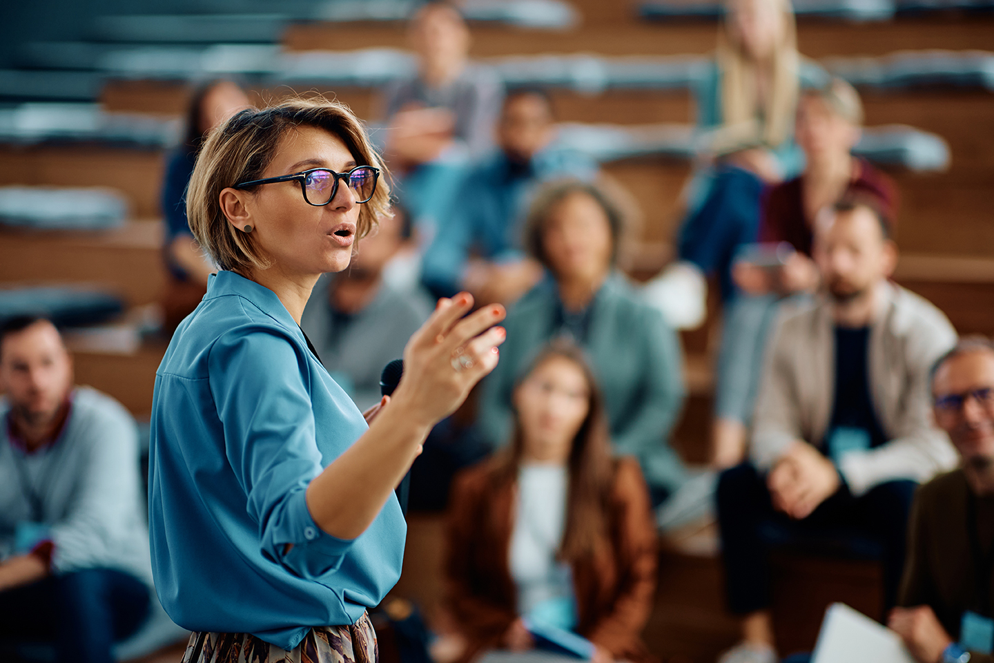 A woman speaking in a lecture hall