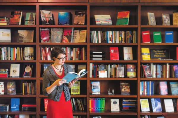 A student peruses a book at the University of Chicago Press 