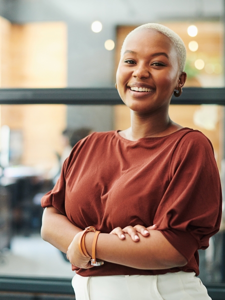 Woman smiling and posing for a photo.