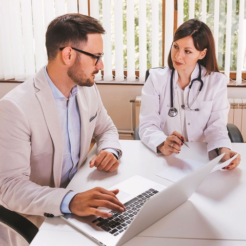 Picture of two doctors discussing statistics