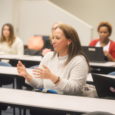Student sitting in classroom talking