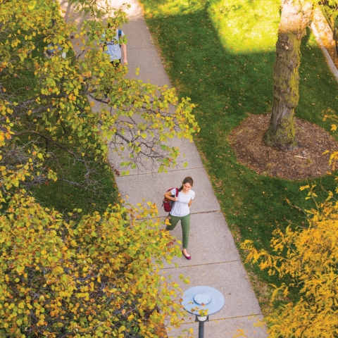 Student walking on UChicago campus