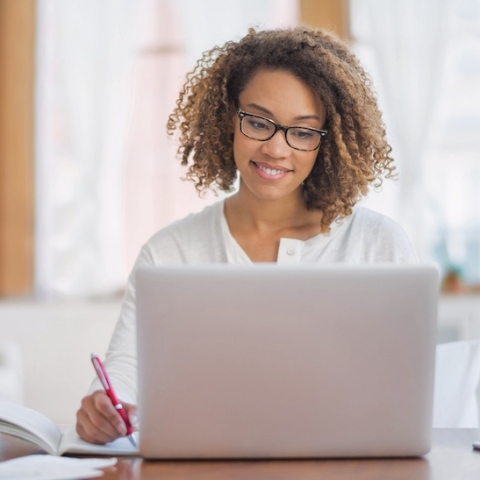 woman looking at computer
