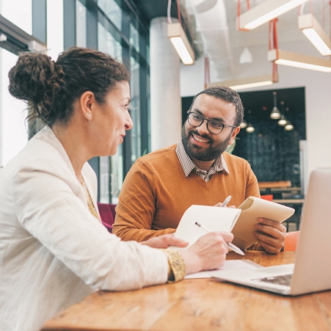Graduate Student-at-Large Business: two people talking to each other