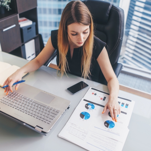 A woman looking at data in her office.