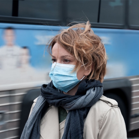 Woman commuting in a face mask
