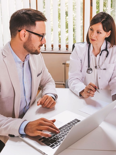 Picture of two doctors discussing statistics