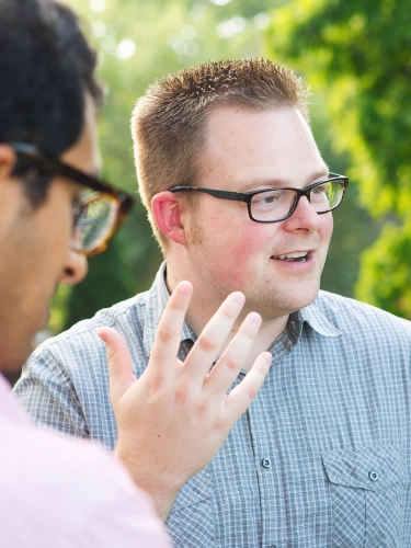 Two students outside talking
