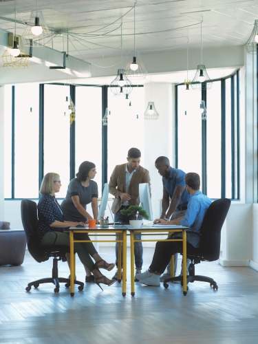 A meeting taking place in a conference room.