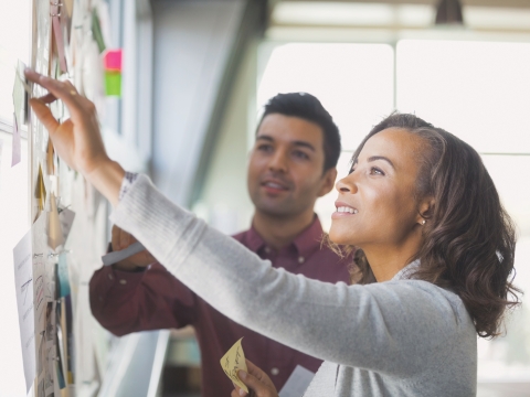 Woman working at whiteboard