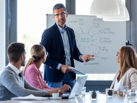 A teacher explains SEO to a group of marketing students