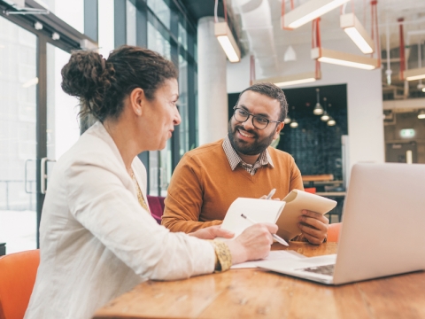 Graduate Student-at-Large Business: two people talking to each other