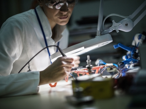 Scientist in a lab room.
