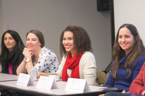 Students sitting at a table in a classroom